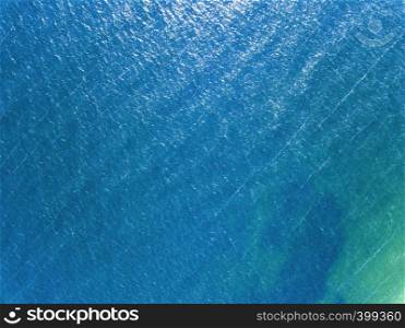 Blue sea surface summer sunny day. Aerial view of the drone as a natural layout. Aerial photography from the drone sea blue surface. Natural summer background