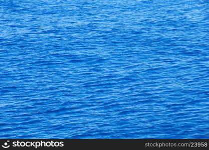 Blue sea surface with waves