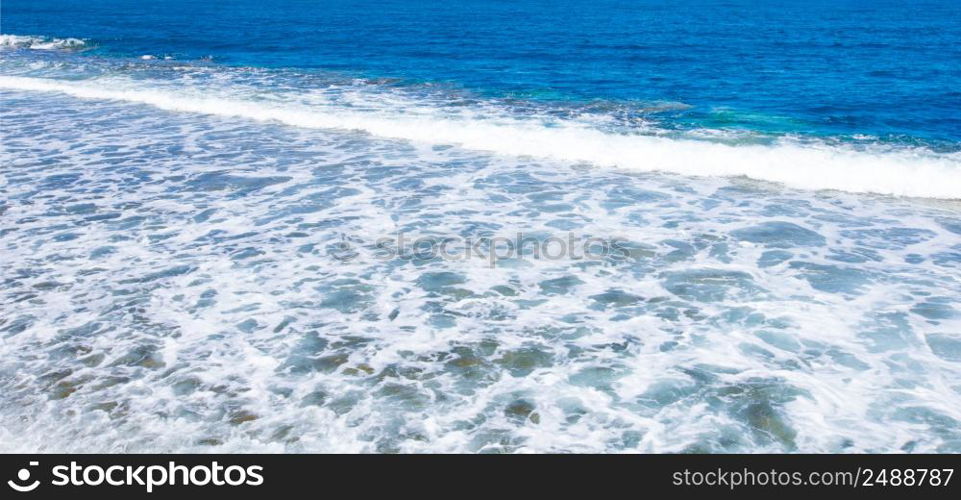 Blue sea surface with waves