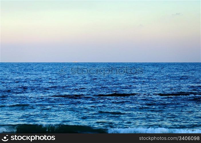 blue sea, the horizon, a iridescent sky, ship on the horizon