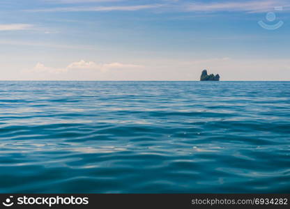 blue sea water and a small island on the horizon, Krabi, Thailand