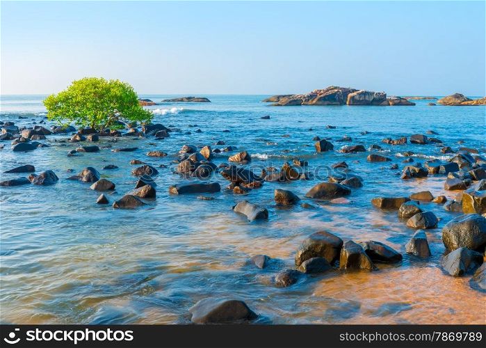 blue sea water and scattered stones