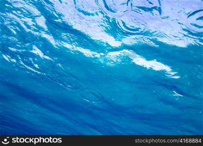 Blue sea water surface view from underwater