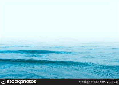 Blue sea water with white sky for design copy space