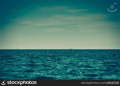 Blue seascape, idyllic shot of calm sea water and tower with antennas. Marine objects concept.. Calm sea water and tower with antennas