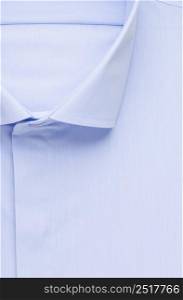 blue shirt, detailed close-up collar and button, top view. shirt, top view
