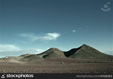 Blue sky and arid hills