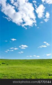blue sky and green hills