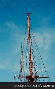 blue sky and mast of old sailing ship in the seaport