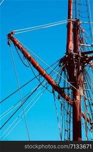 blue sky and mast of old sailing ship in the seaport