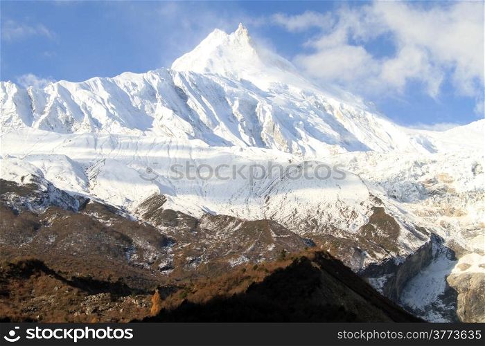 Blue sky and peak of Manaslu in Nepal