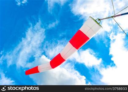 blue sky and striped windsock
