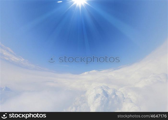 blue sky and sun.. bright blue sky with sun shining and some clouds