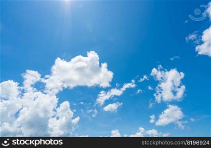 Blue sky and white clouds with sunlight on sunny day. World ozone day concept. Blue sky background for international day for the preservation of the ozone layer. Cloudscape. Hot weather in summer.