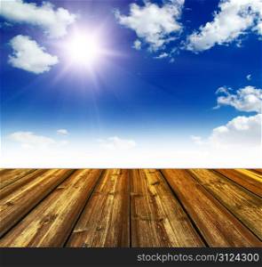 blue sky and wood floor background
