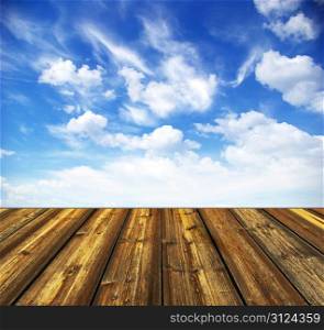 blue sky and wood floor background