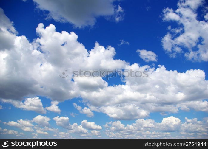 Blue sky background with a tiny clouds