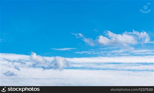 Blue sky background with clouds, copy space for text.