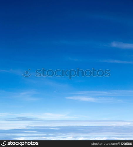 blue sky background with tiny clouds