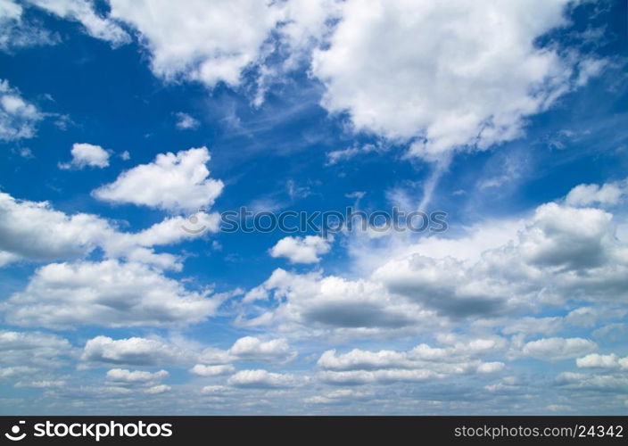 Blue sky background with tiny clouds