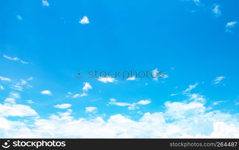 blue sky background with tiny clouds