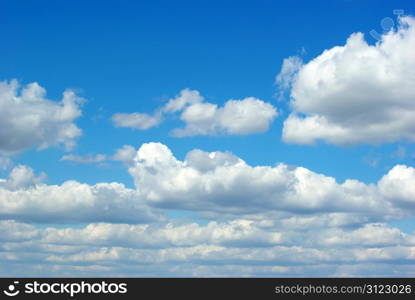 Blue sky background with tiny clouds