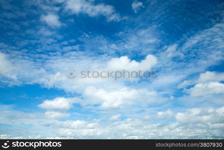 blue sky background with tiny clouds