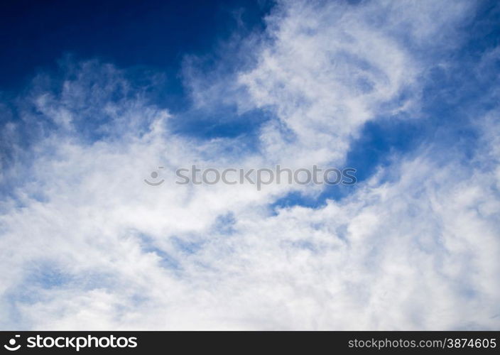 blue sky background with tiny clouds