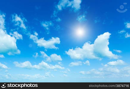 Blue sky background with tiny clouds