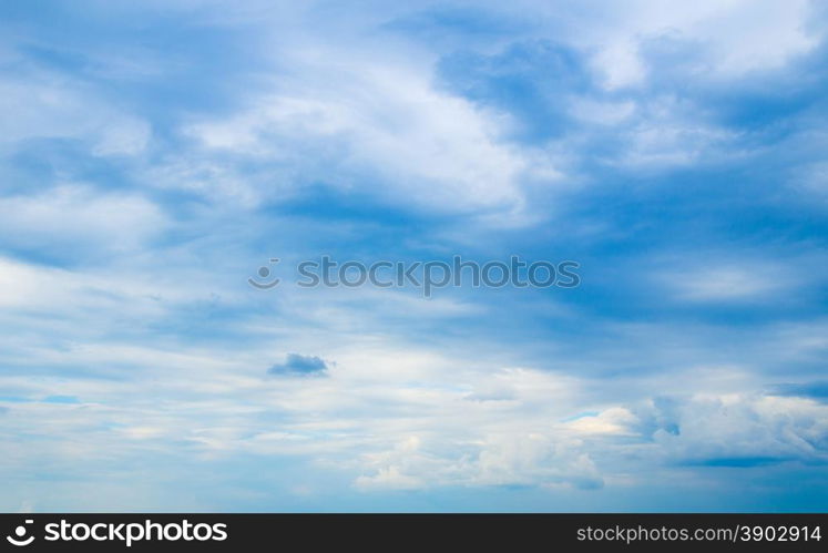 blue sky background with tiny clouds