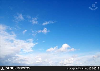 blue sky background with tiny clouds