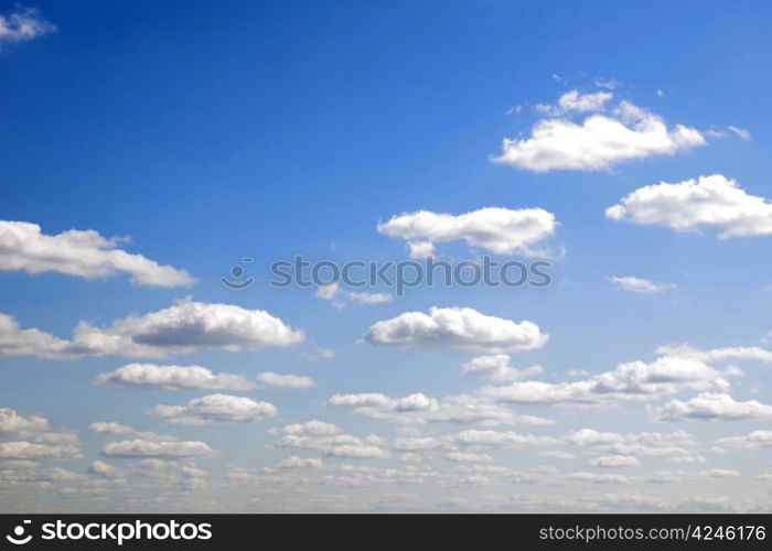 blue sky background with tiny clouds