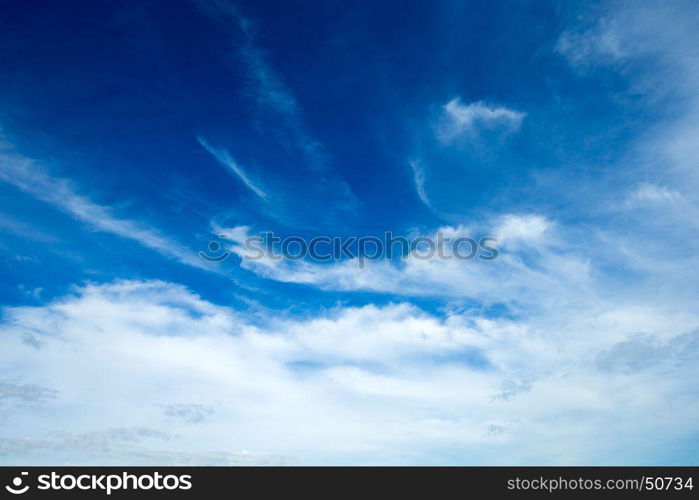 blue sky background with tiny clouds