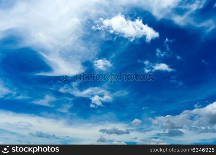 blue sky background with tiny clouds