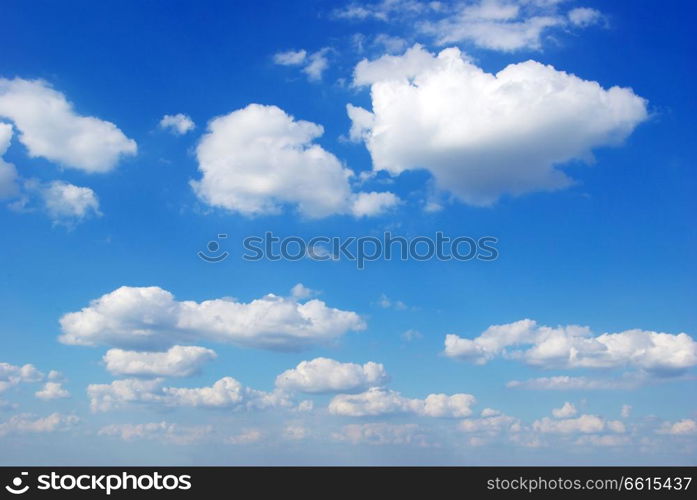 blue sky background with tiny clouds