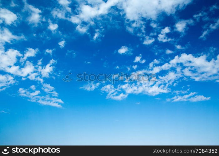 blue sky background with tiny clouds