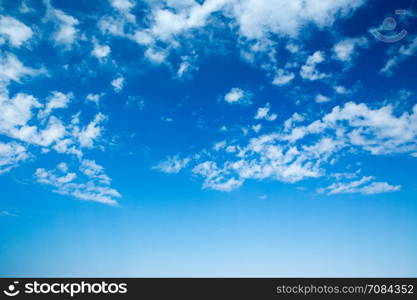 blue sky background with tiny clouds