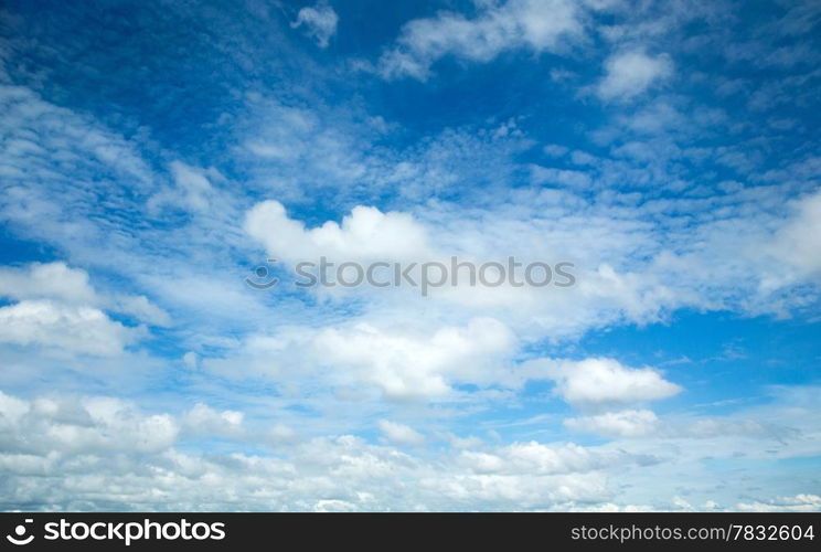 blue sky background with tiny clouds