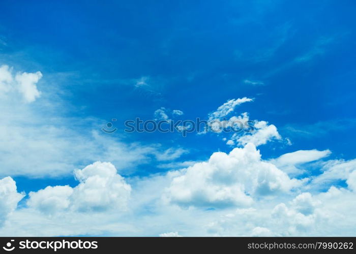 Blue sky background with tiny clouds