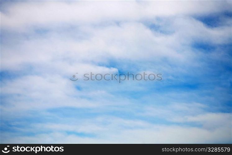 blue sky covered with the film of the clouds
