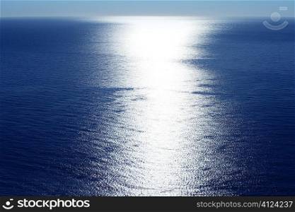 Blue sky horizon bird view with sun reflexion white line
