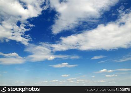 blue sky is covered by white fluffy clouds