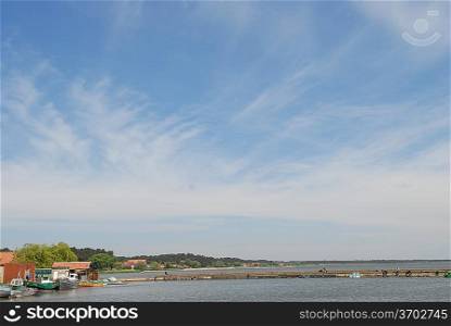 blue sky over sea and settlement