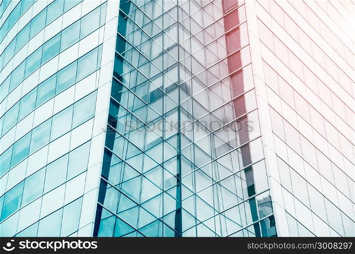 Blue sky reflected in the glass building. Abstract architecture pattern background. Modern blue texture for business background.
