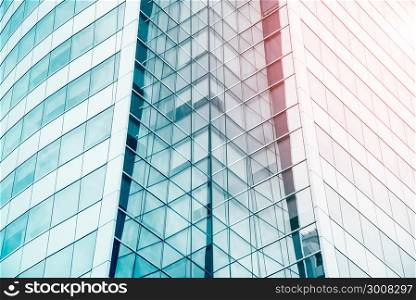 Blue sky reflected in the glass building. Abstract architecture pattern background. Modern blue texture for business background.