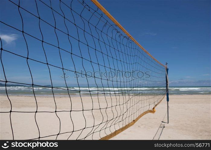 blue sky through beach volleyball net on the beach