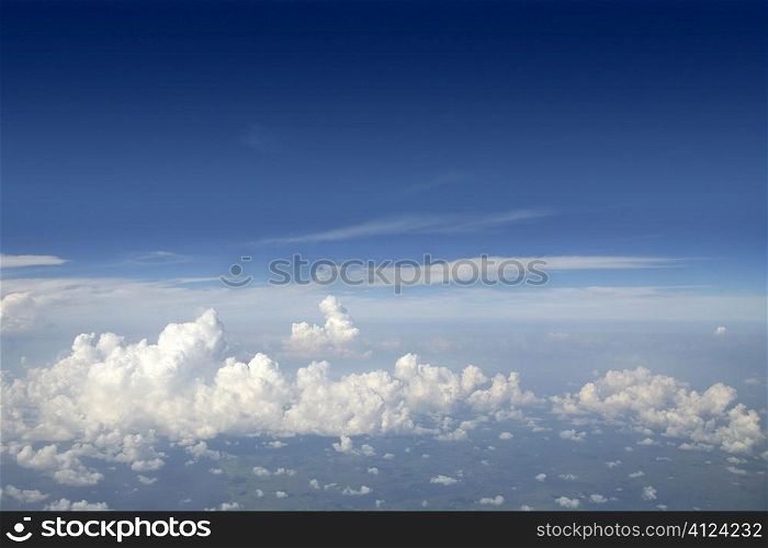 Blue sky view from aircraft airplane and white clouds
