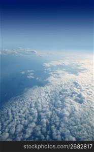 Blue sky view from aircraft airplane white clouds