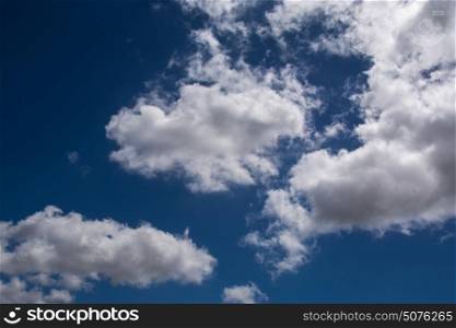 Blue sky whit fluffy cotton clouds background