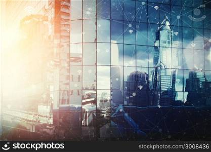 Blue sky with cloud in sunset light reflected in modern city and wireless communication network.Internet of Things and ICT Information Communication Technology concept. Vintage tone filtered.